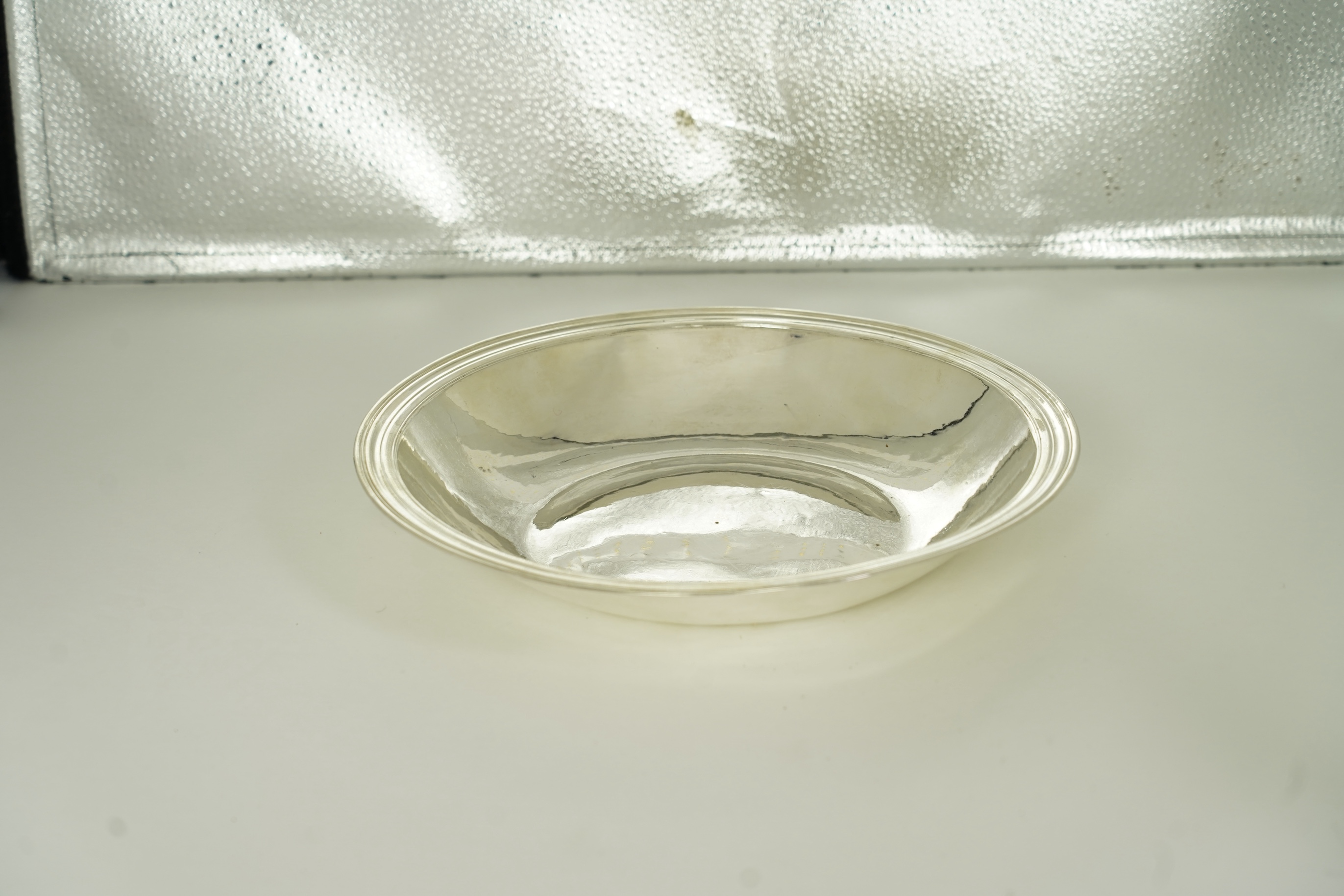 A rare late Charles II silver circular deep plate, makers mark 'D' (Jackson's reference P.139)